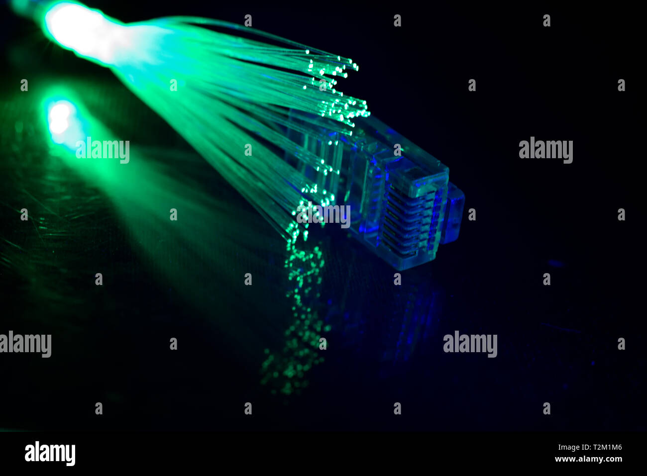 Network cable with fiber optics light on black background Stock Photo ...