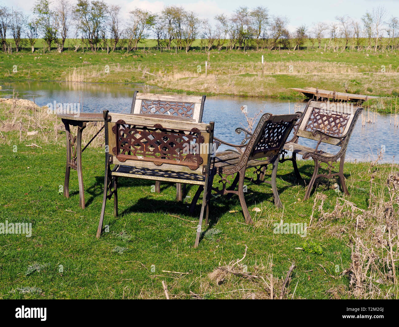 Heavy Cast Iron And Wood Garden Furniture In A Slightly Surreal