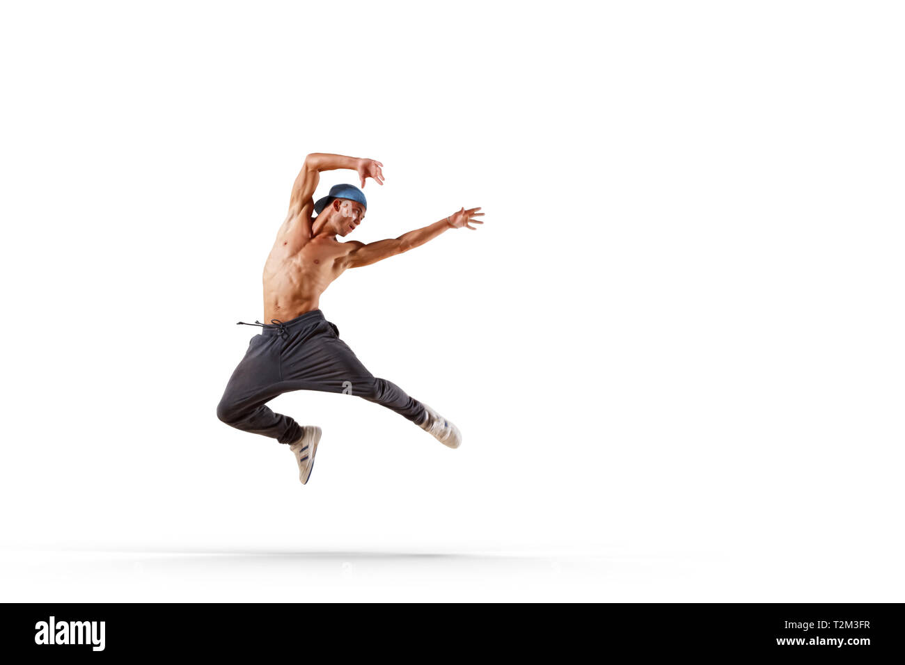 Young hip hop dancer performing over white background Stock Photo - Alamy