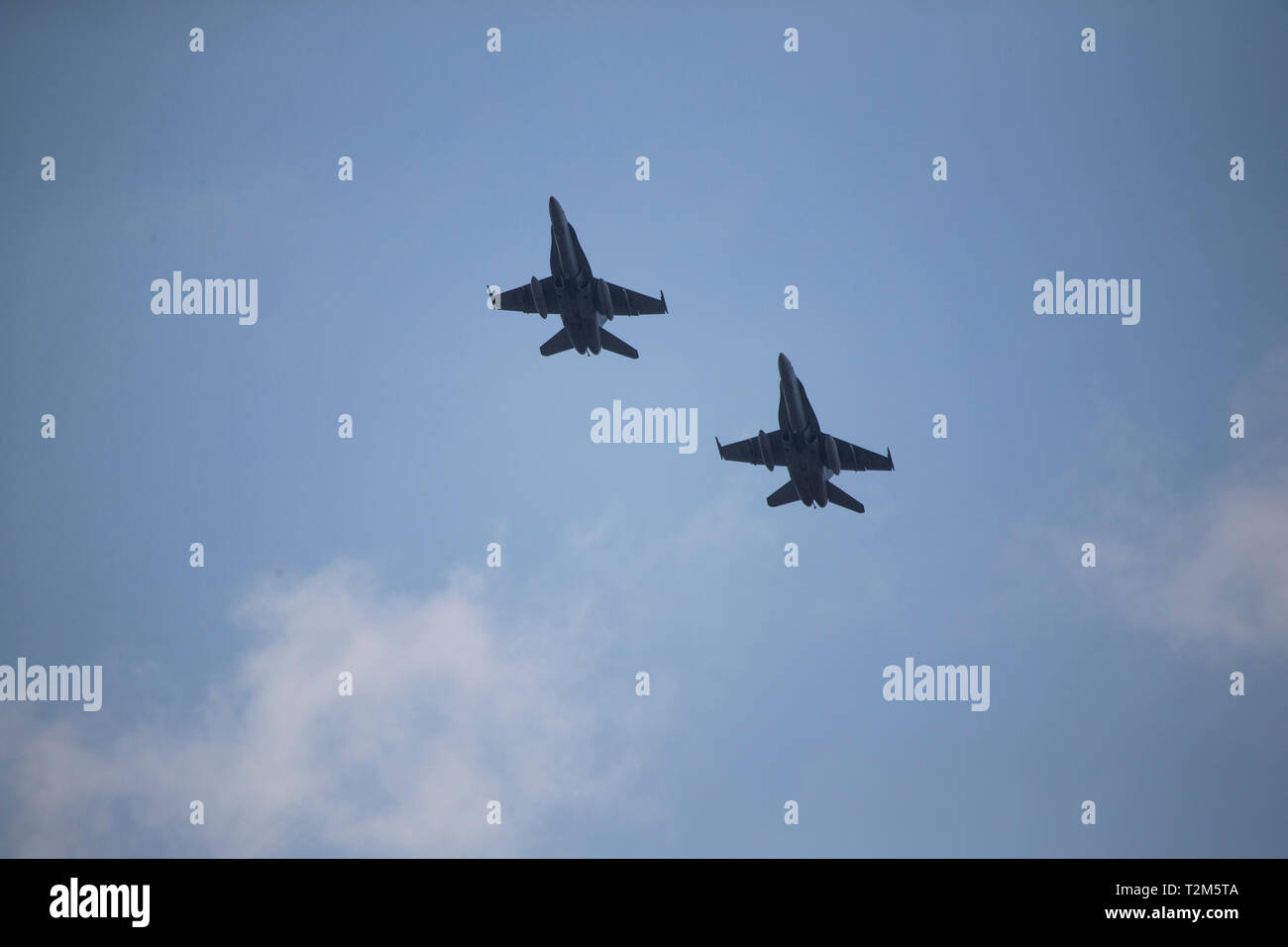 U.S. Marine Corps F/A-18C Hornets with Marine Fighter Attack Squadron 232 prepare to land at Clark Air Base, Philippines, March 29, 2019 before exercise Balikatan. Exercise Balikatan is a multilateral exercise that provides realistic quick-response training between the U.S., Australia and Philippines. The exercise promotes regional security and humanitarian efforts for U.S. allies and partners. (U.S. Marine Corps photo by Lance Cpl. Tyler Harmon) Stock Photo