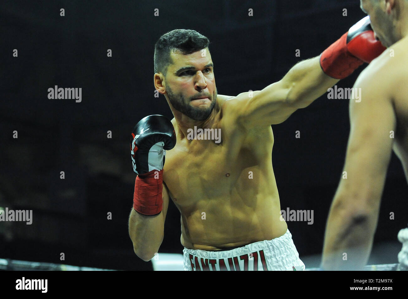 Chess boxers Arik Braun (R) and Felix Bartels sit in front of a chequer  board during the Chess Boxing Championships in Berlin, Germany, 28 July  2012. The chess boxing event took place