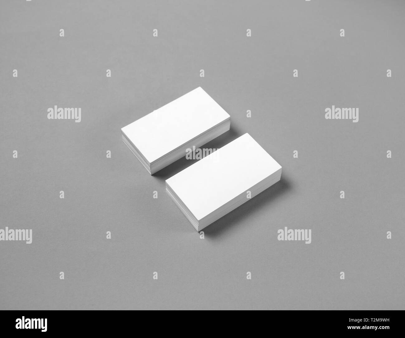 Blank business cards mockup on gray paper background. Copy space for text. Stock Photo