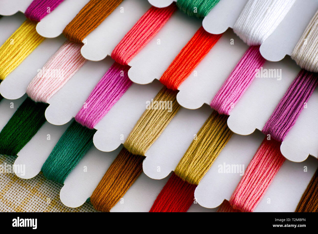 Colored embroidery threads on spools. Closeup Stock Photo Alamy