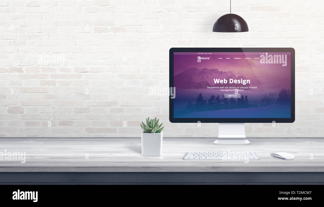 Modern theme on computer display. Professional studio concept with free space on wall for text. Stock Photo