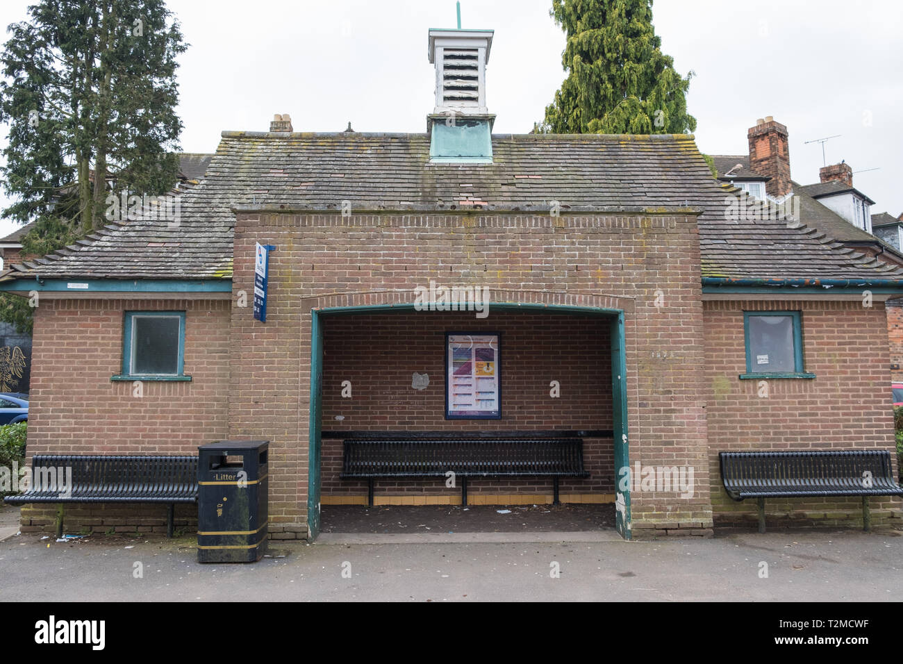 Large brick bus shelter in the village of Knowle near Solihull in the west Midlands Stock Photo