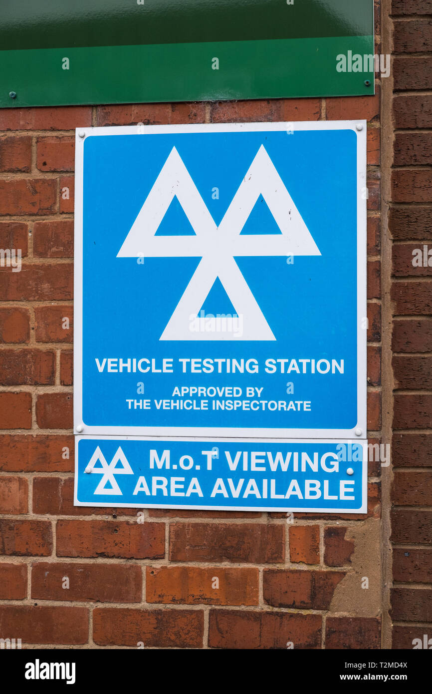 Sign at garage which is a Vehicle Testing Station for car MOT Stock Photo