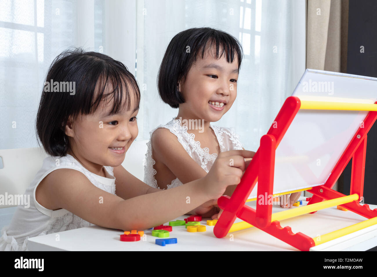 Asian Chinese little girls playing toys at home Stock Photo - Alamy