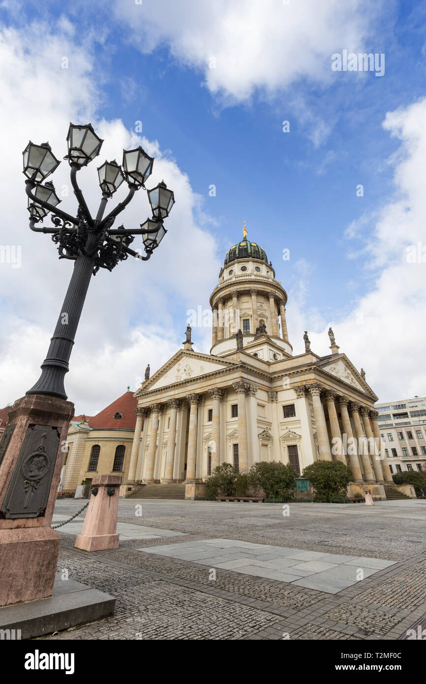 Old streetlight and Französischer Dom (French Cathedral) at the Gendarmenmarkt Square in Berlin, Germany. Stock Photo