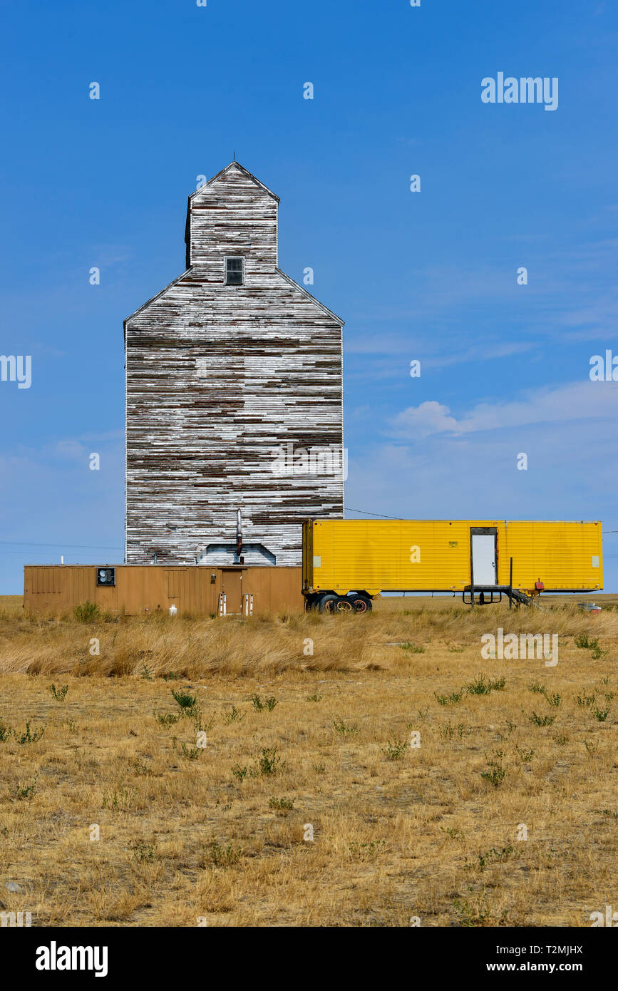 Grain elevator with yellow trailer in Montana, USA Stock Photo Alamy