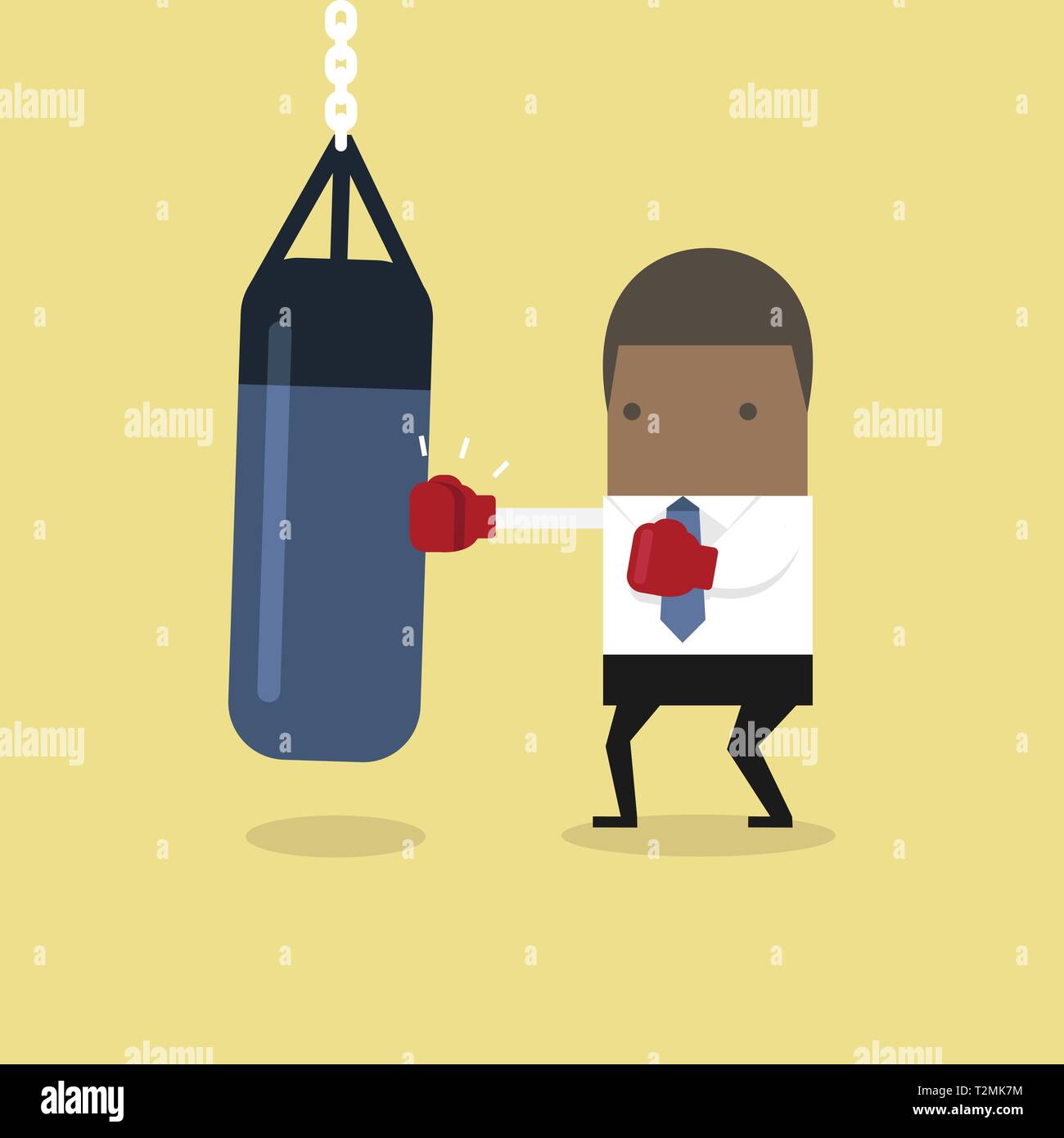 African businessman wearing boxing gloves and punching the punch bag