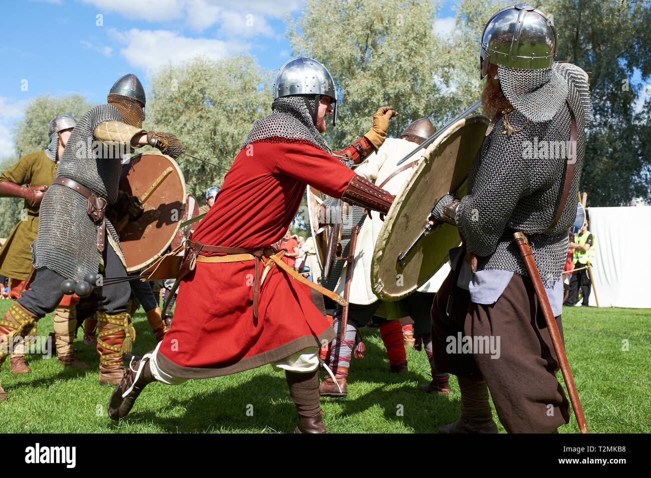 Hämeenlinna, Finland -  August 17, 2014: Vikings fighting with swords and shields at the medieval festival on a sunny summer day. Stock Photo