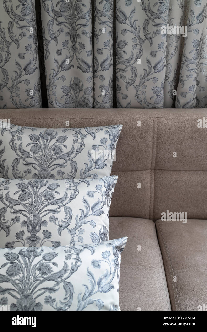 A Decorative pillows and curtains of the same fabric Stock Photo