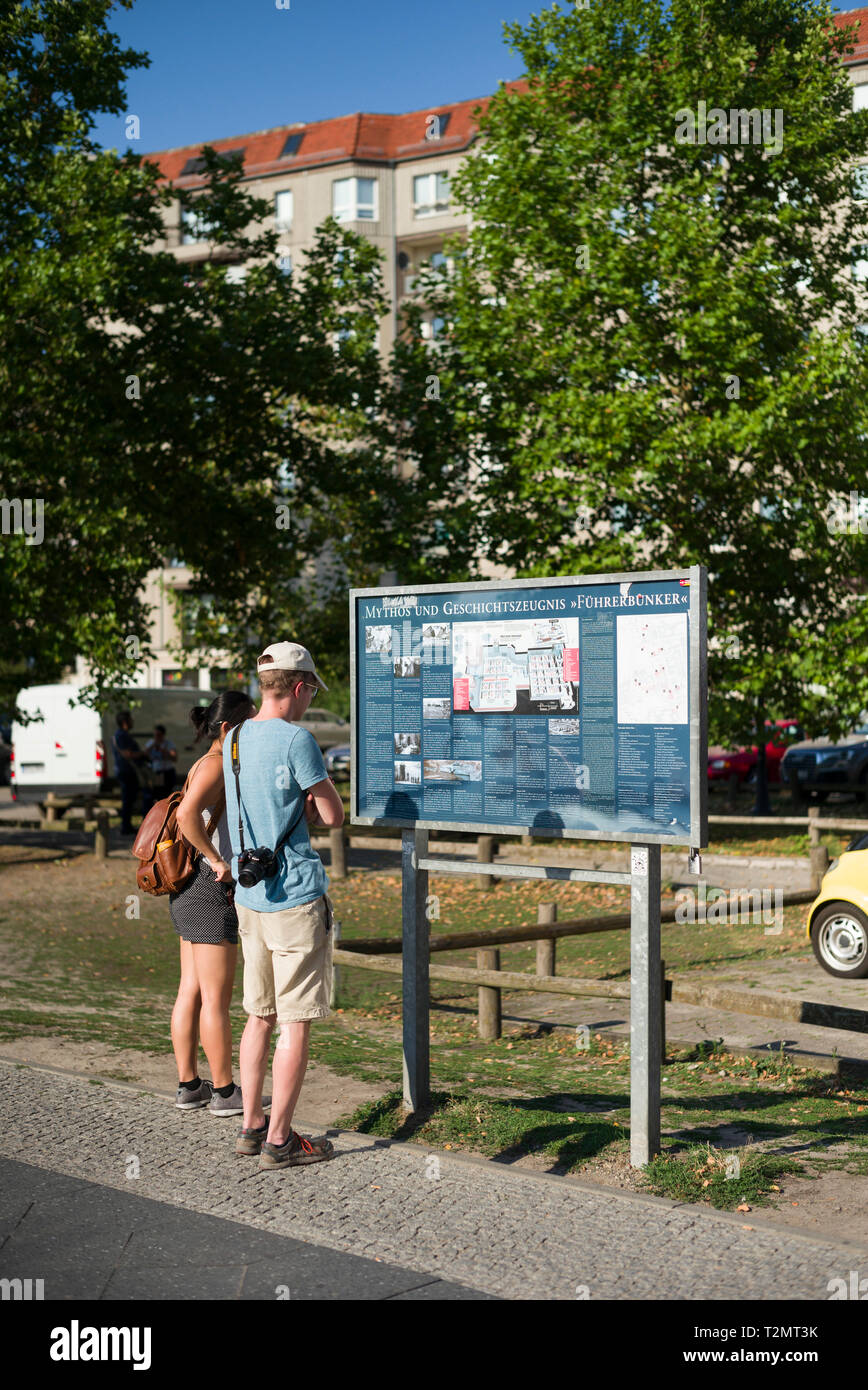 Berlin. Germany. Tourists visiting the site of Hitler's bunker (Führerbunker), where Adolf Hitler and Eva Braun comitted suicide in 1945, located at I Stock Photo