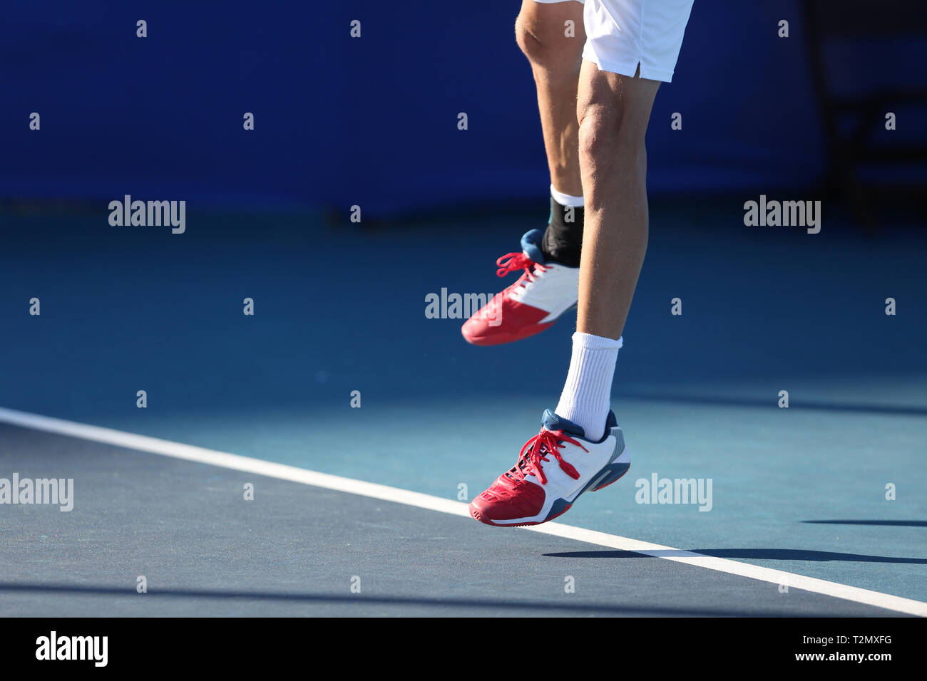 tenis player jumping Stock Photo