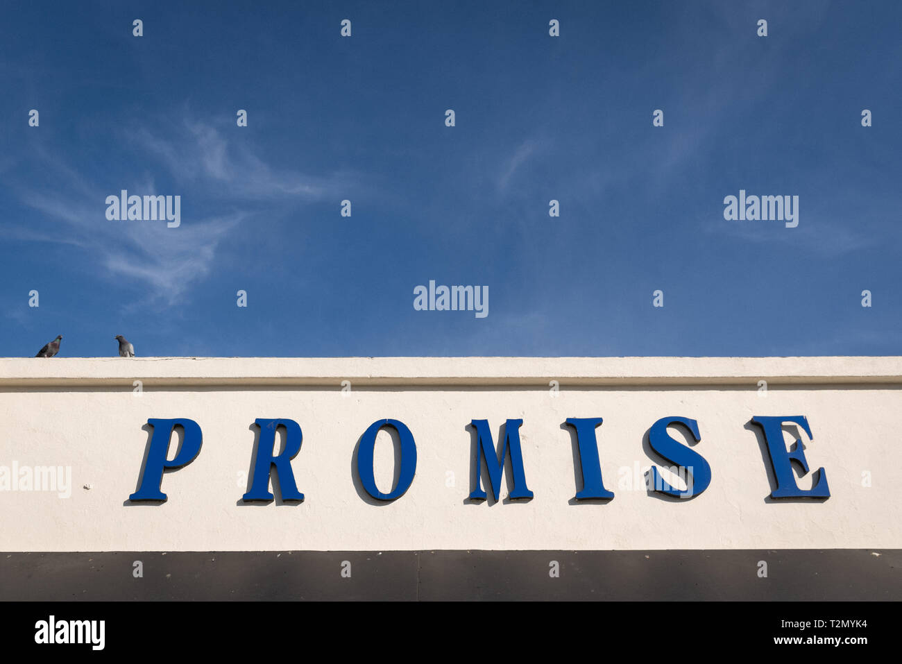 'Promise' sign on facade of clothing store of that name, in the Fashion District of Los Angeles, California. Stock Photo