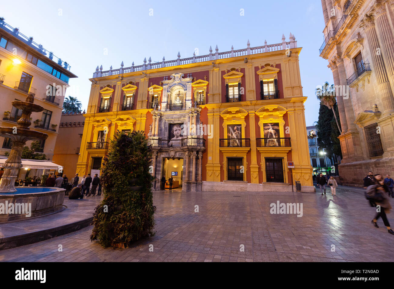 Bishops Palace, Plaza del Obispo, Malaga old town, Spain, lit up at at twilight Stock Photo