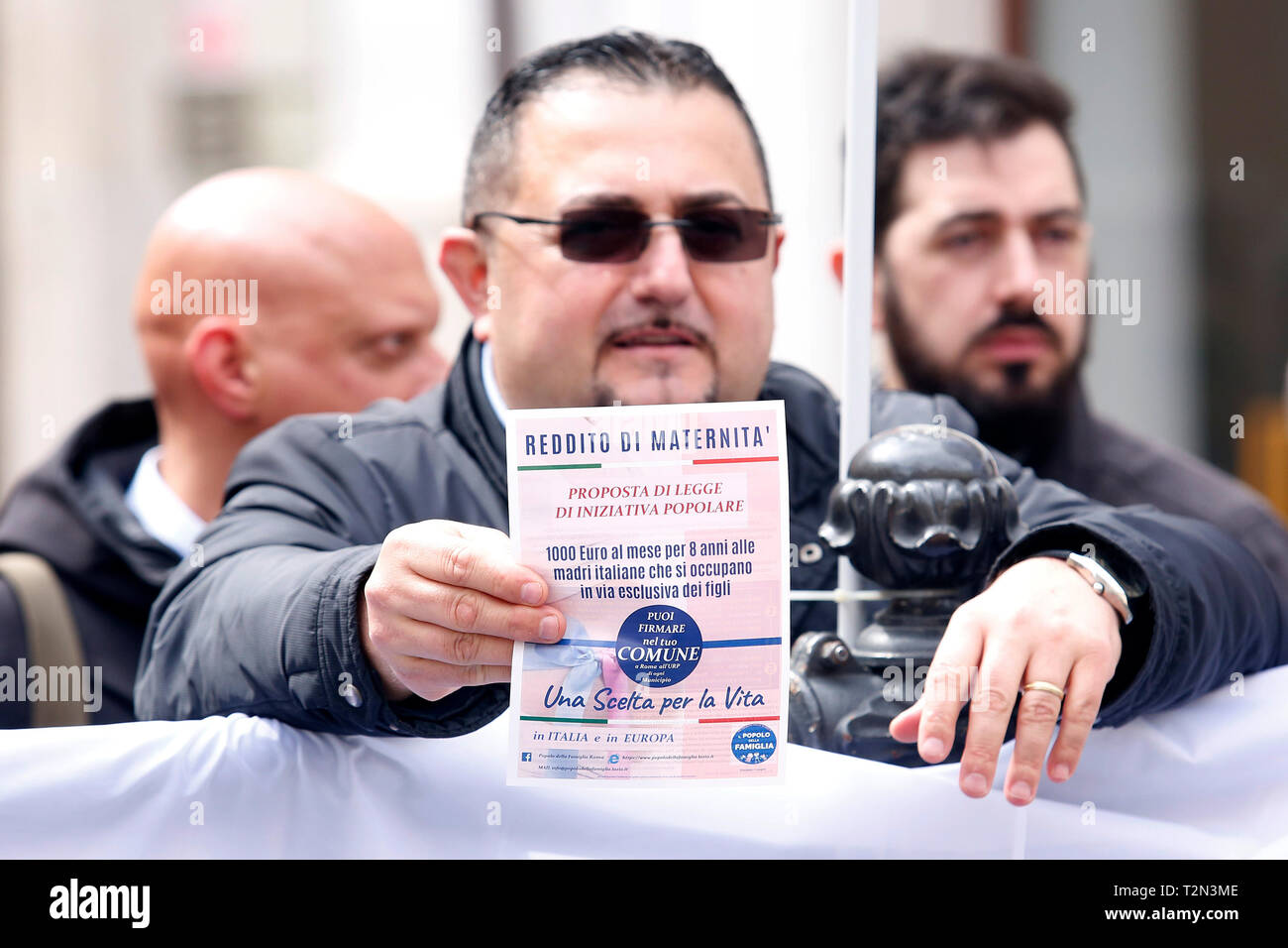 A man showing a law propose, that wants to give women 1000E per month for 8 years to Italian women that don't work to take care exclusively of their children  Rome April 4th 2019. Demonstration of the People of Family. People of Family is a social conservative political movement in Italy. photo di Samantha Zucchi/Insidefoto Stock Photo