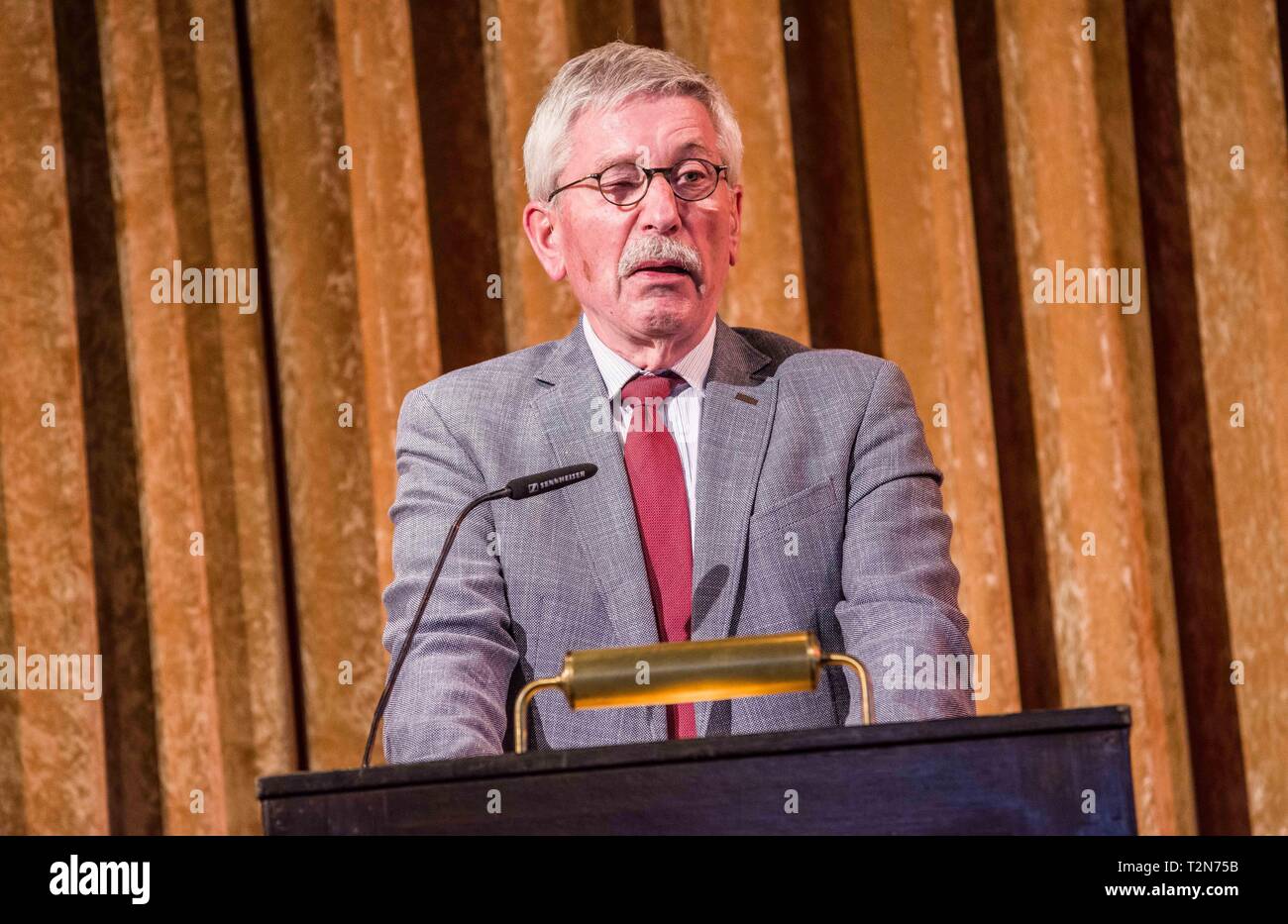 Munich, Bavaria, Germany. 3rd Apr, 2019. Controversial politician and book author THILO SARRAZIN held a speaking engagement in the Munich Kuenstlerhaus to approximately 100 fans, largely from right-extremist, islamophobic, far-right, and neo nazi circles, with some under Verfassungsschutz monitoring, such as Michael Stuerzenberger. Sarrazin held a discussion in support of his book ''die Fremde Uebernahme'' (''Hostile Takeover''). An accredited journalist was also held by security and insulted as ''from Antifa'', which then resulted in hostilities directed by others towards him. Furthermor Stock Photo