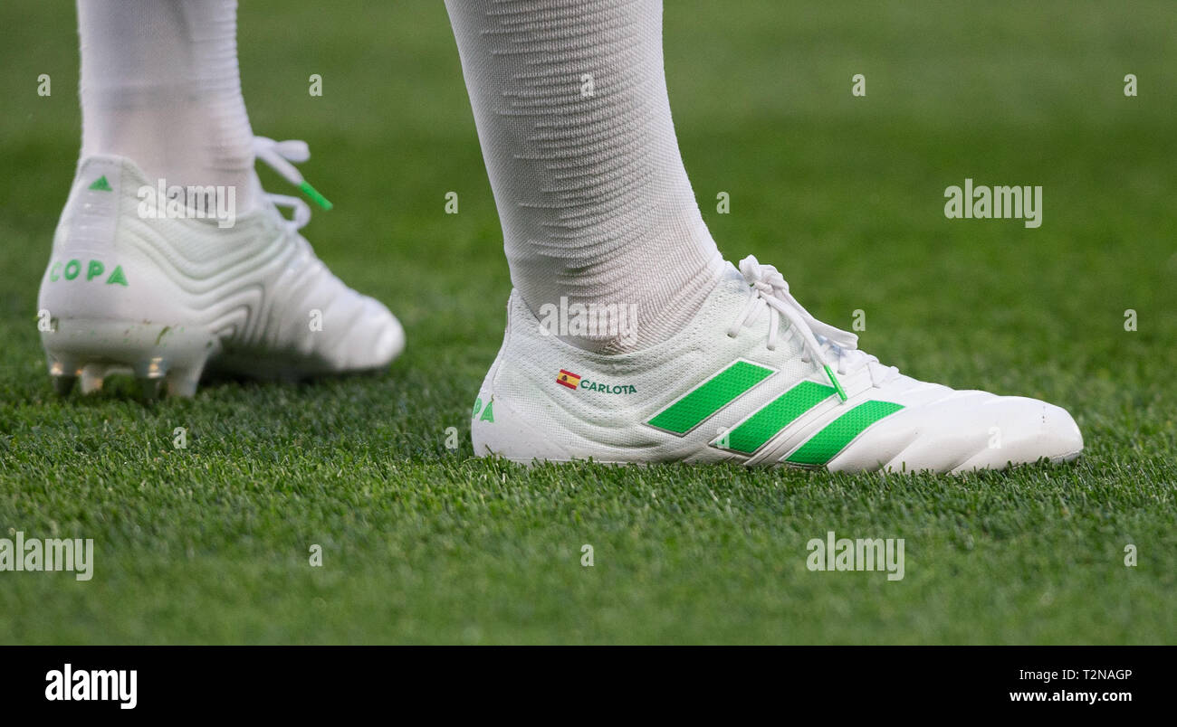 London, UK. 03rd Apr, 2019. The new Adidas colour boots of Cesar Azpilicueta of Chelsea displaying Spain flag and CARLOTA during the Premier League match between Chelsea and Brighton and Hove
