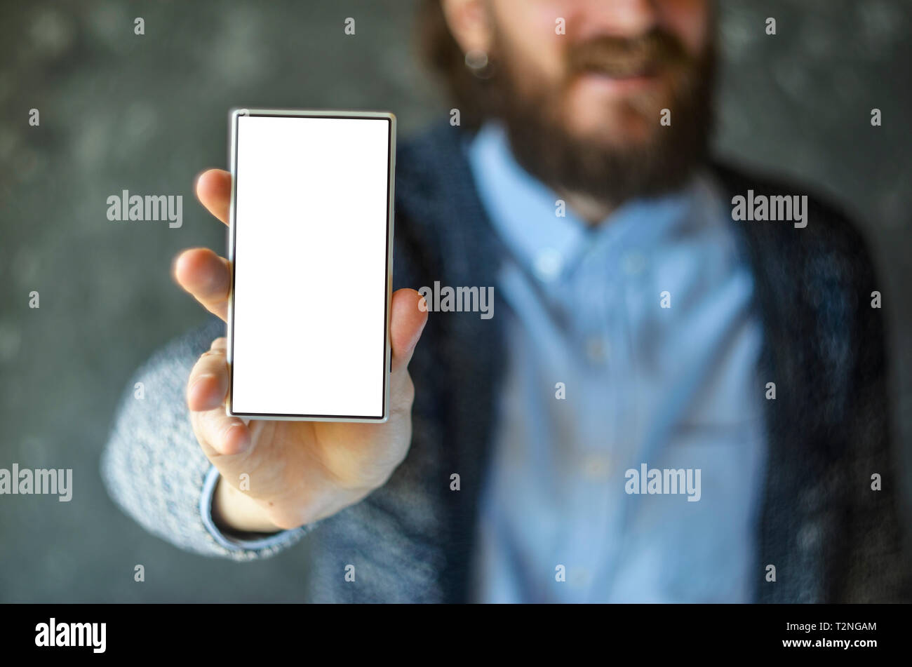 Blurry Man with a Beard Show Phone Screen. Isolated with White Phone Screen. Cope Space Background Stock Photo