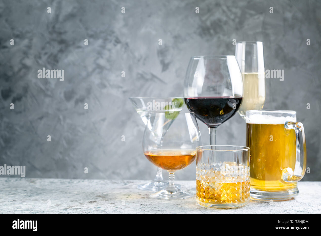 Selection of alcoholic drinks - beer, wine, martini, champagne, cognac, whiskey, rustic background Stock Photo