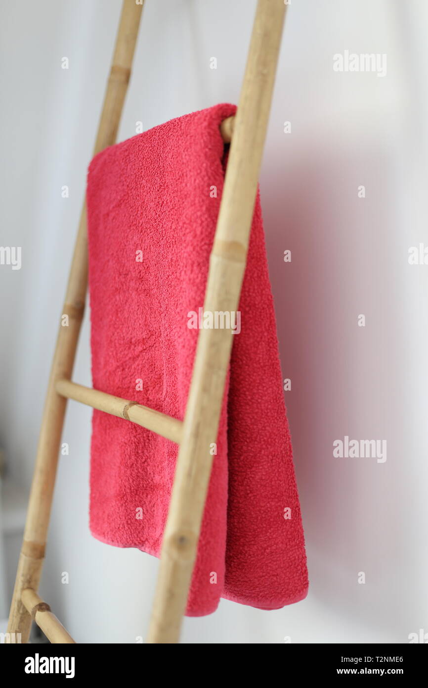 A Bamboo bathroom towel rack Stock Photo - Alamy