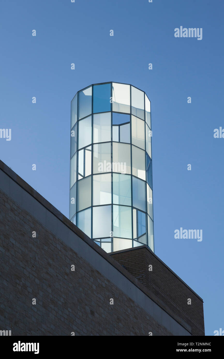 The Lantern catches the evening light, a glass and steel beacon created by the artist Daniela Schönbächler for the curved entrance façade of the new W Stock Photo