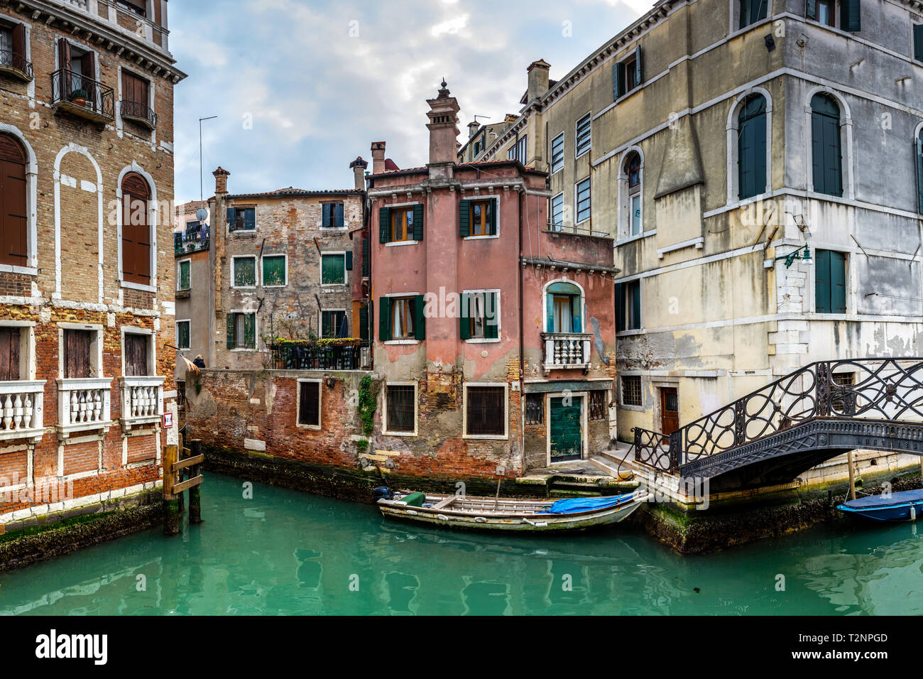 Canal in Venice with traditional old houses, Italy Stock Photo - Alamy