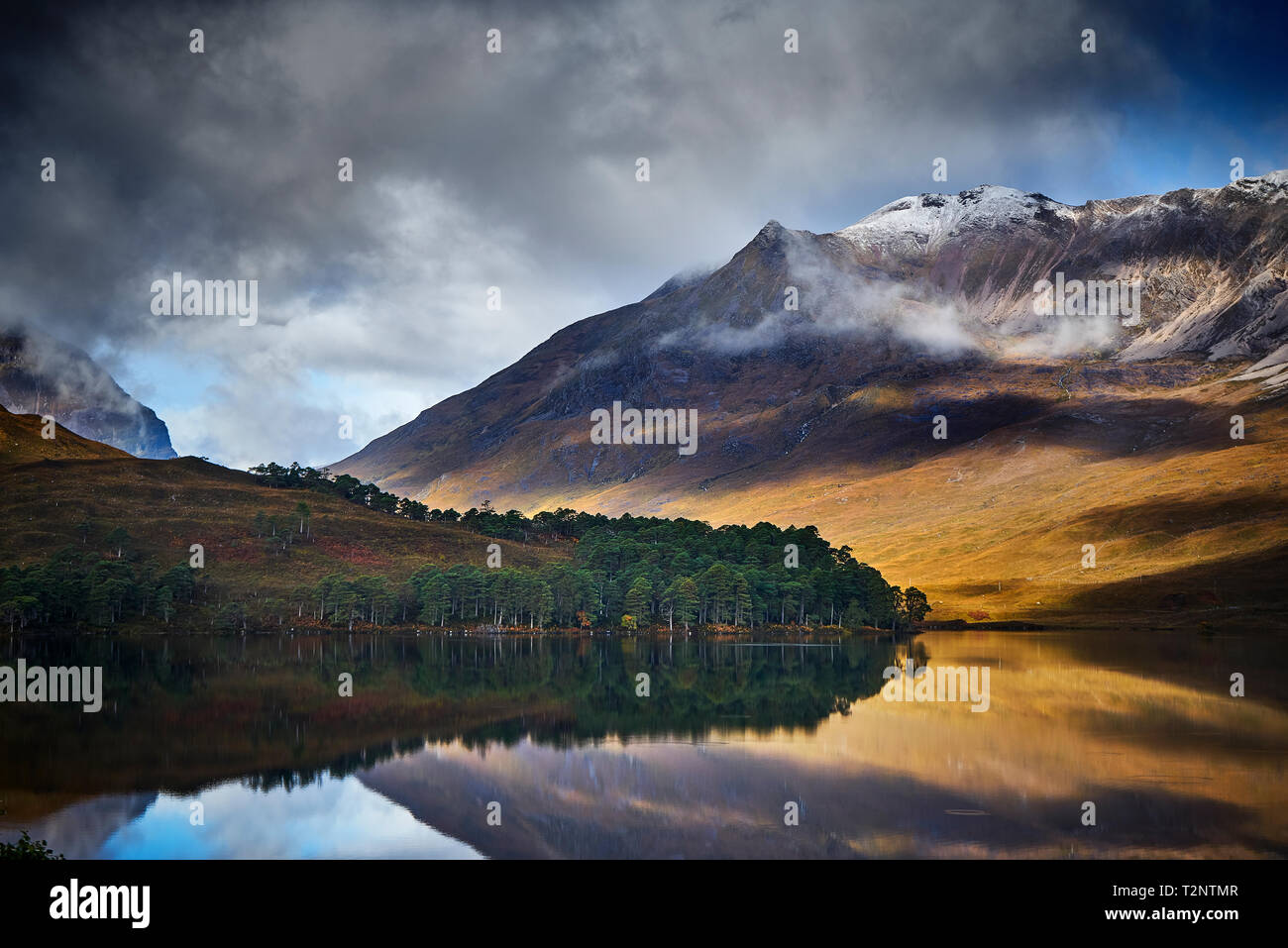 Tranquil mountain landscape mirror imaged in loch, Achnasheen, Scottish Highlands, Scotland Stock Photo