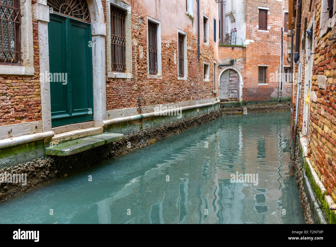 Canal in Venice with traditional old houses, Italy Stock Photo - Alamy