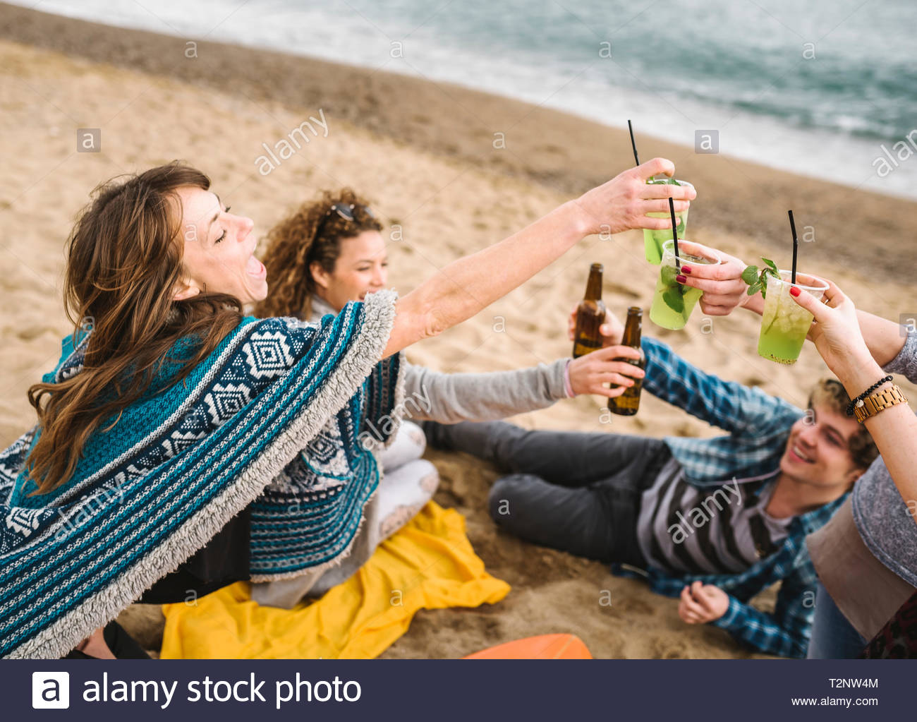 Friends Raising At Toast At Beach Party Barcelona Spain