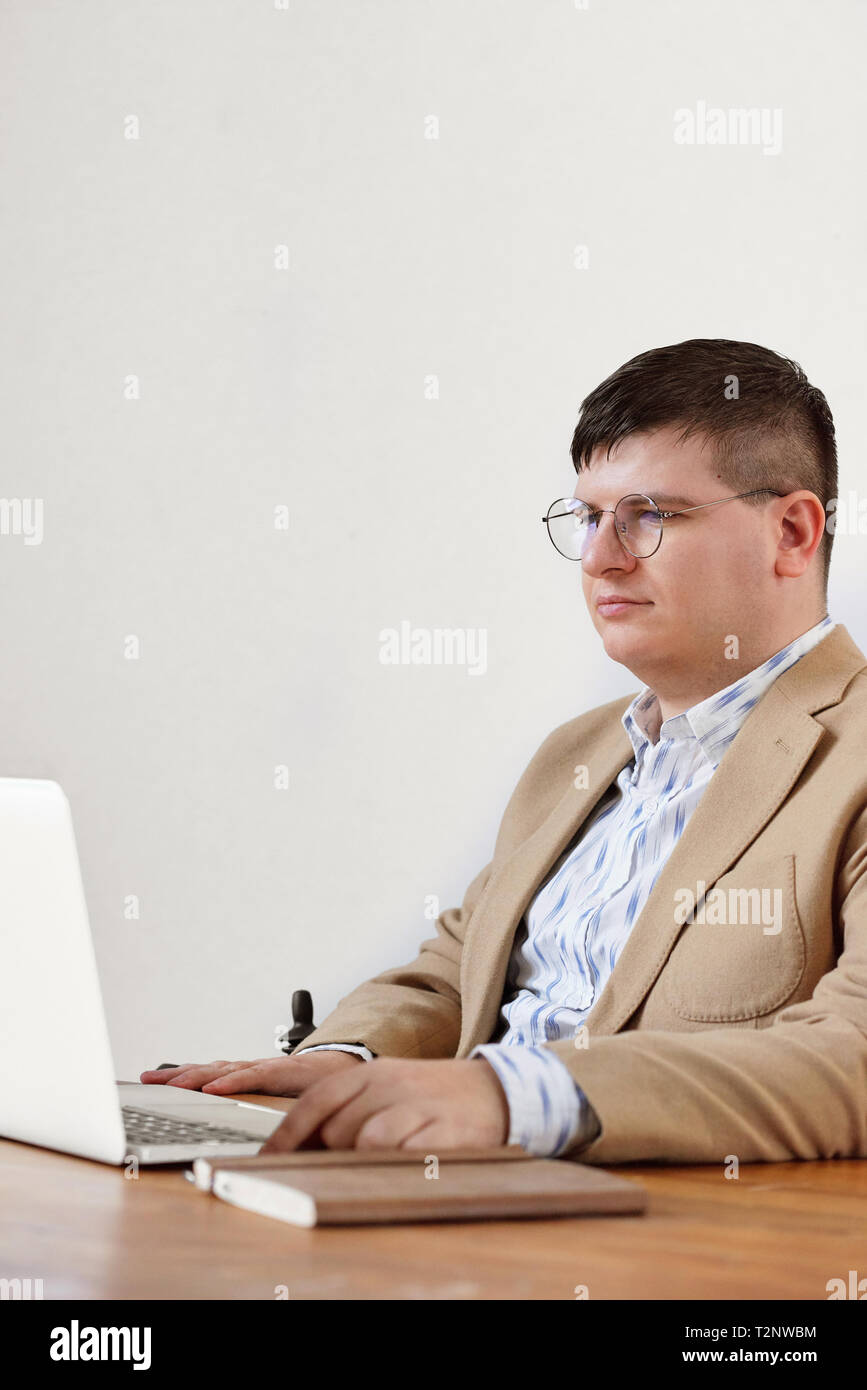 Man working on laptop in home office Stock Photo