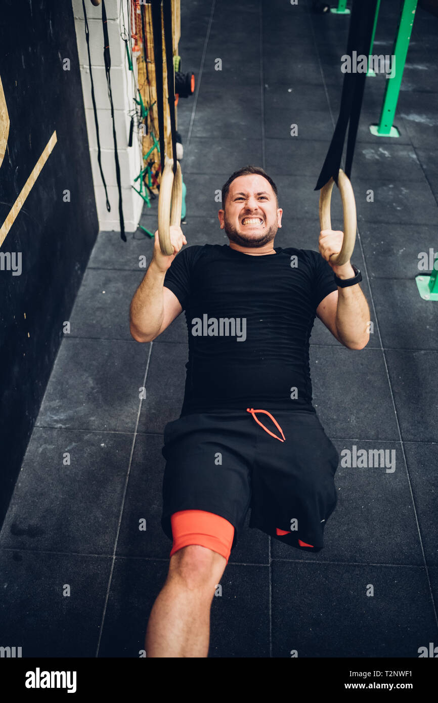 Man with disability training in gym Stock Photo