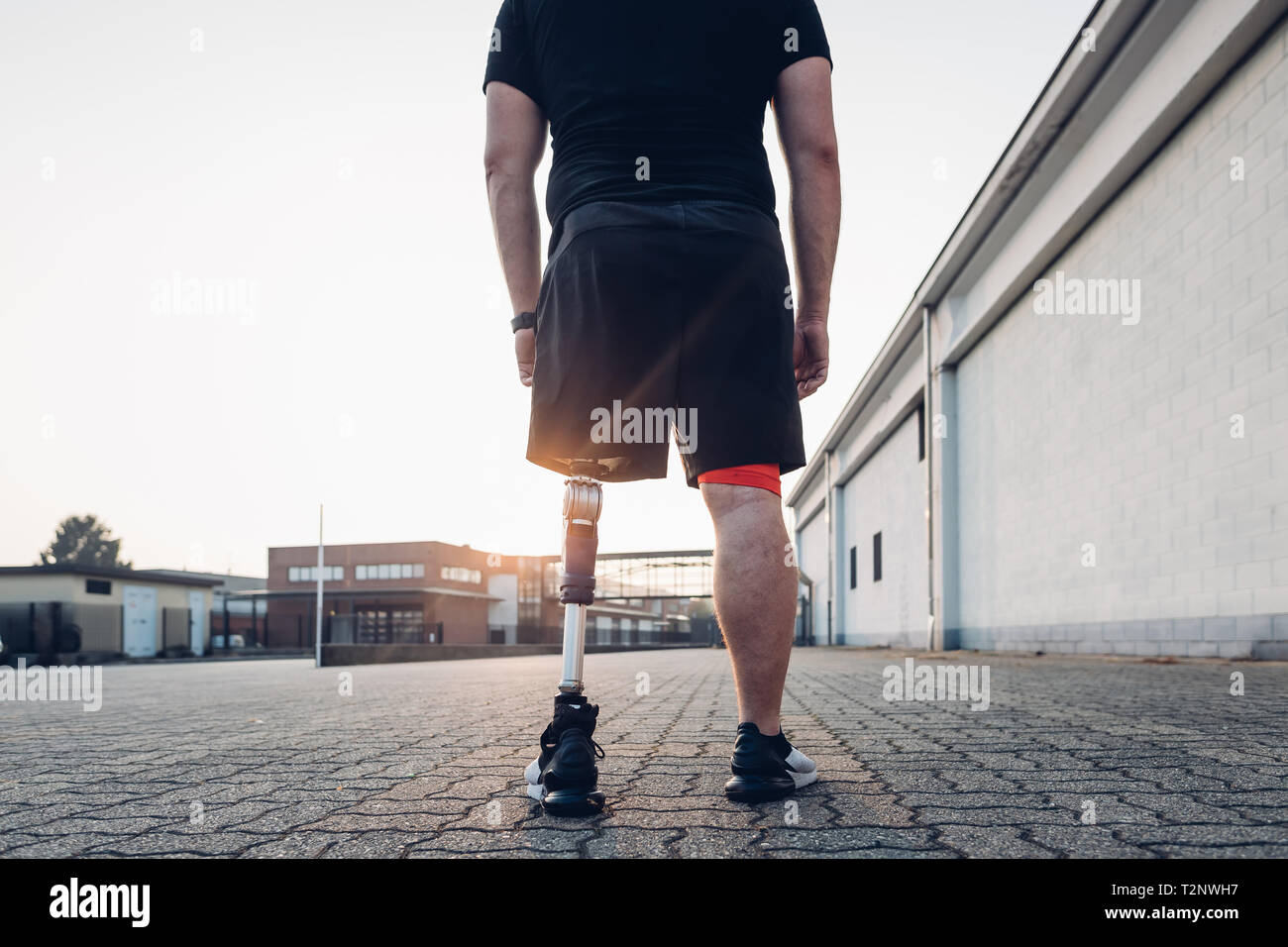Man with prosthetic leg walking Stock Photo