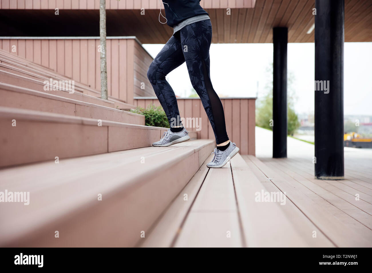 Healthy woman running and climbing up on stairs Stock Photo Alamy