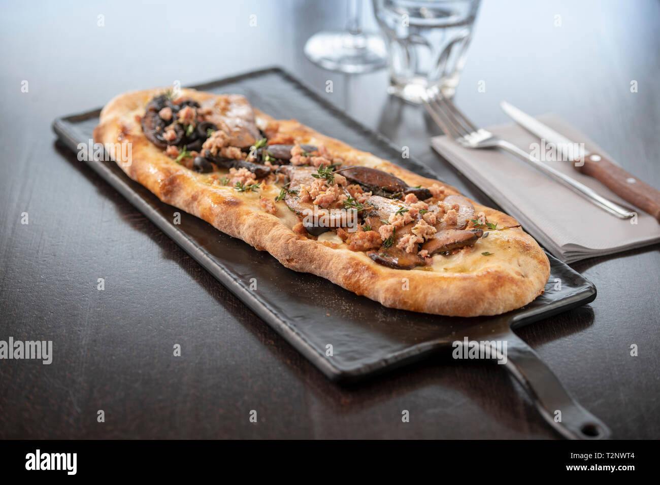 Mushroom and herb Pinsa at Italian Restaurant Stock Photo