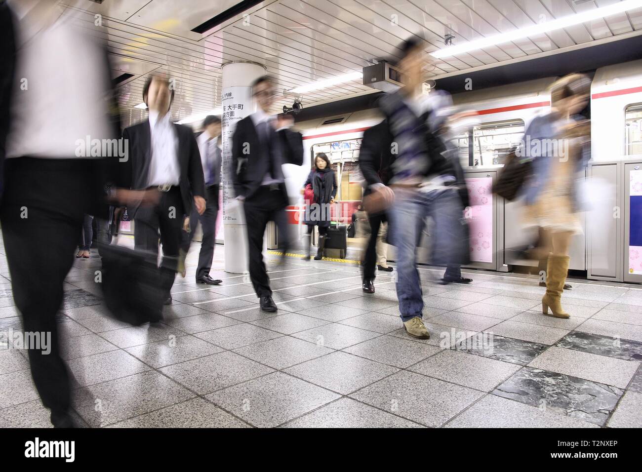 TOKYO, JAPAN - APRIL 13: People exit Tokyo Metro. With more than 3.1 billion annual passenger rides, Tokyo subway system is the busiest worldwide. Stock Photo