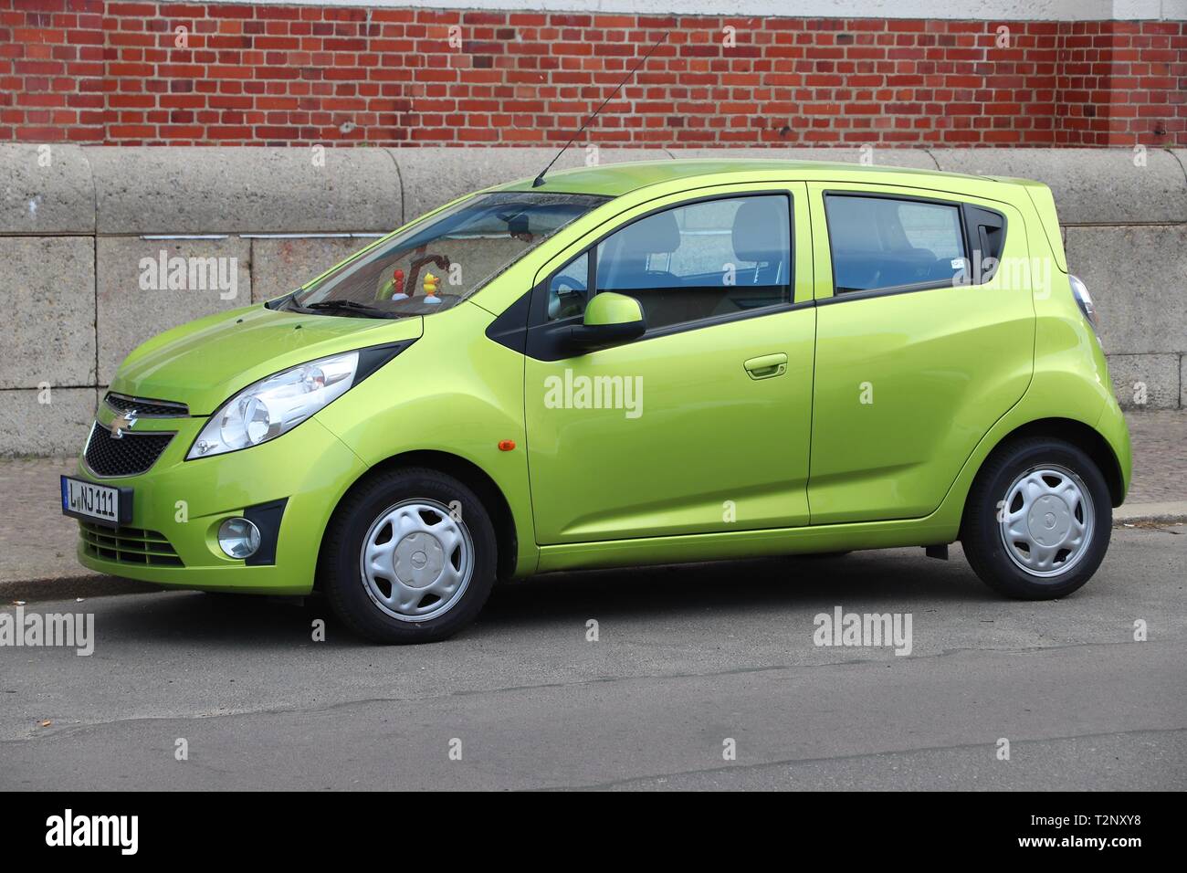 LEIPZIG, GERMANY - MAY 9, 2018: Chevrolet Spark green compact hatchback city car parked in Germany. There were 45.8 million cars registered in Germany Stock Photo