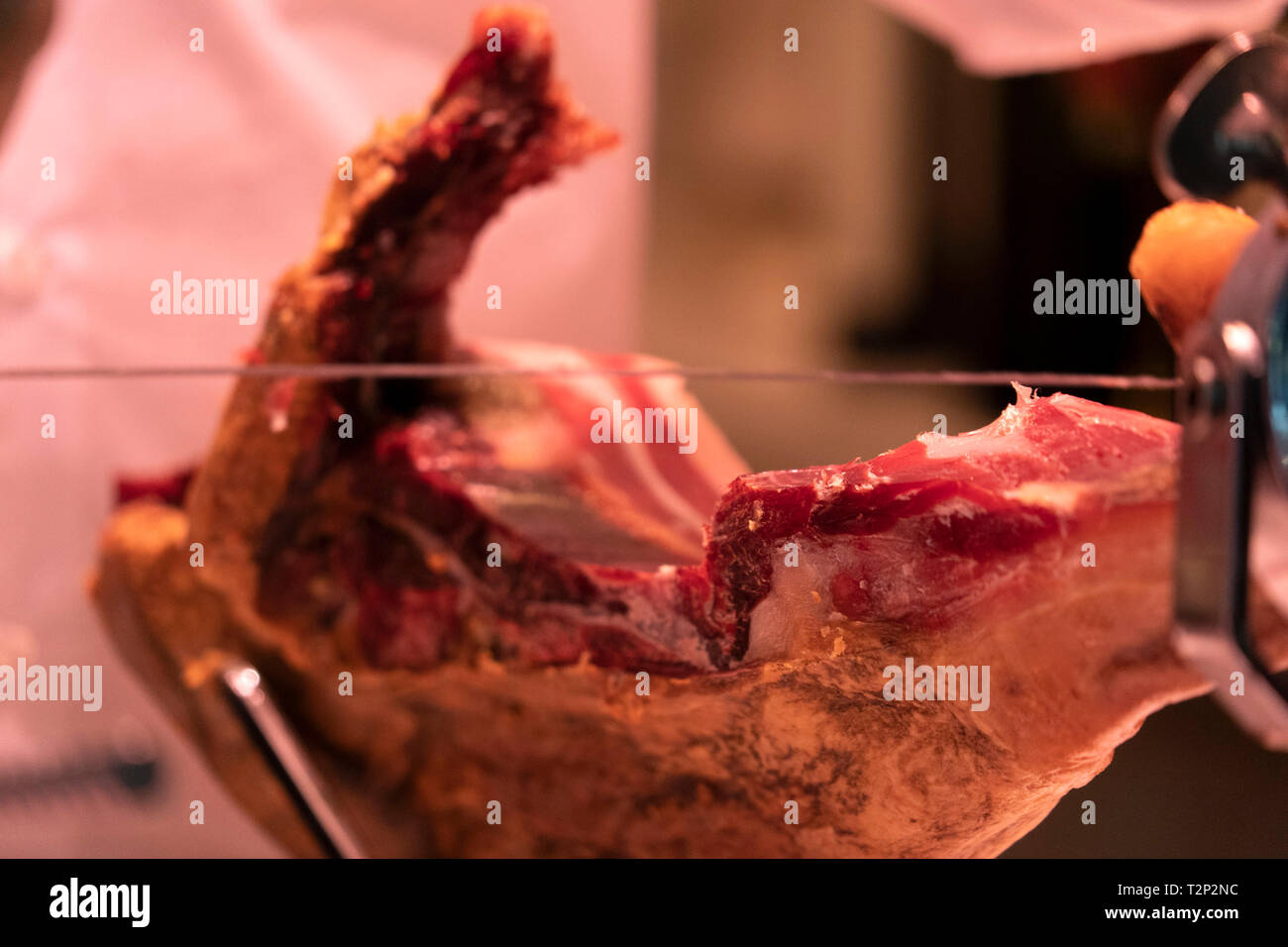 Hands while cutting spanish ham detail Stock Photo Alamy