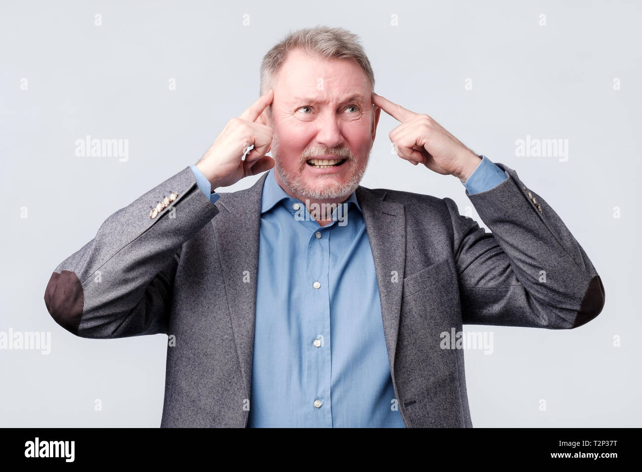 Hand on temples hi-res stock photography and images - Alamy