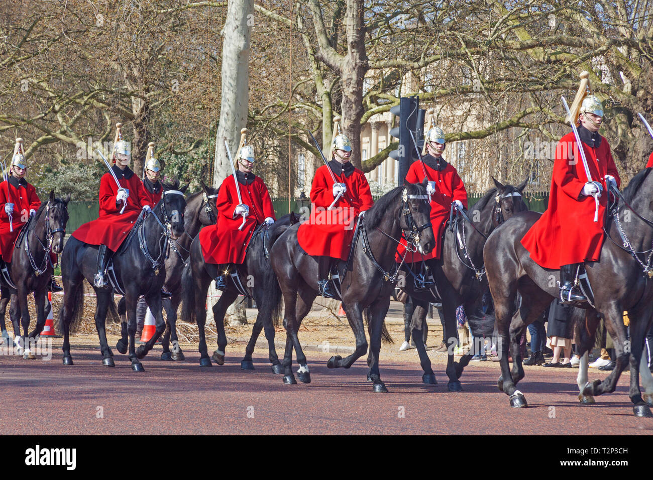London, Westminster.  Troopers of the Royal Life Guards in The Mall, en route to The Changing of the Guard at Horse Guards Parade. Stock Photo