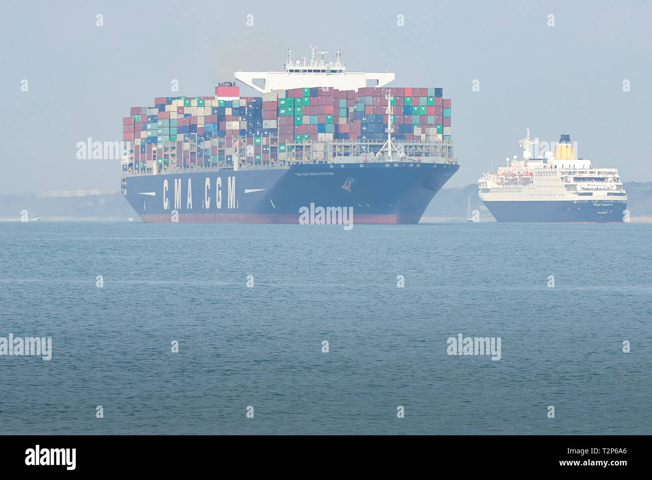 The Container Ship CMA CGM GEORG FORSTER, Leaving The Port Of Southampton, The SAGA SAPPHIRE Passing To Port. 28 March 2019. Stock Photo