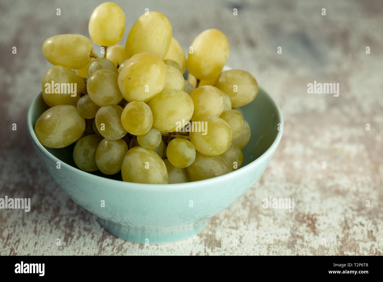Wine Grapes in blue bowl Stock Photo