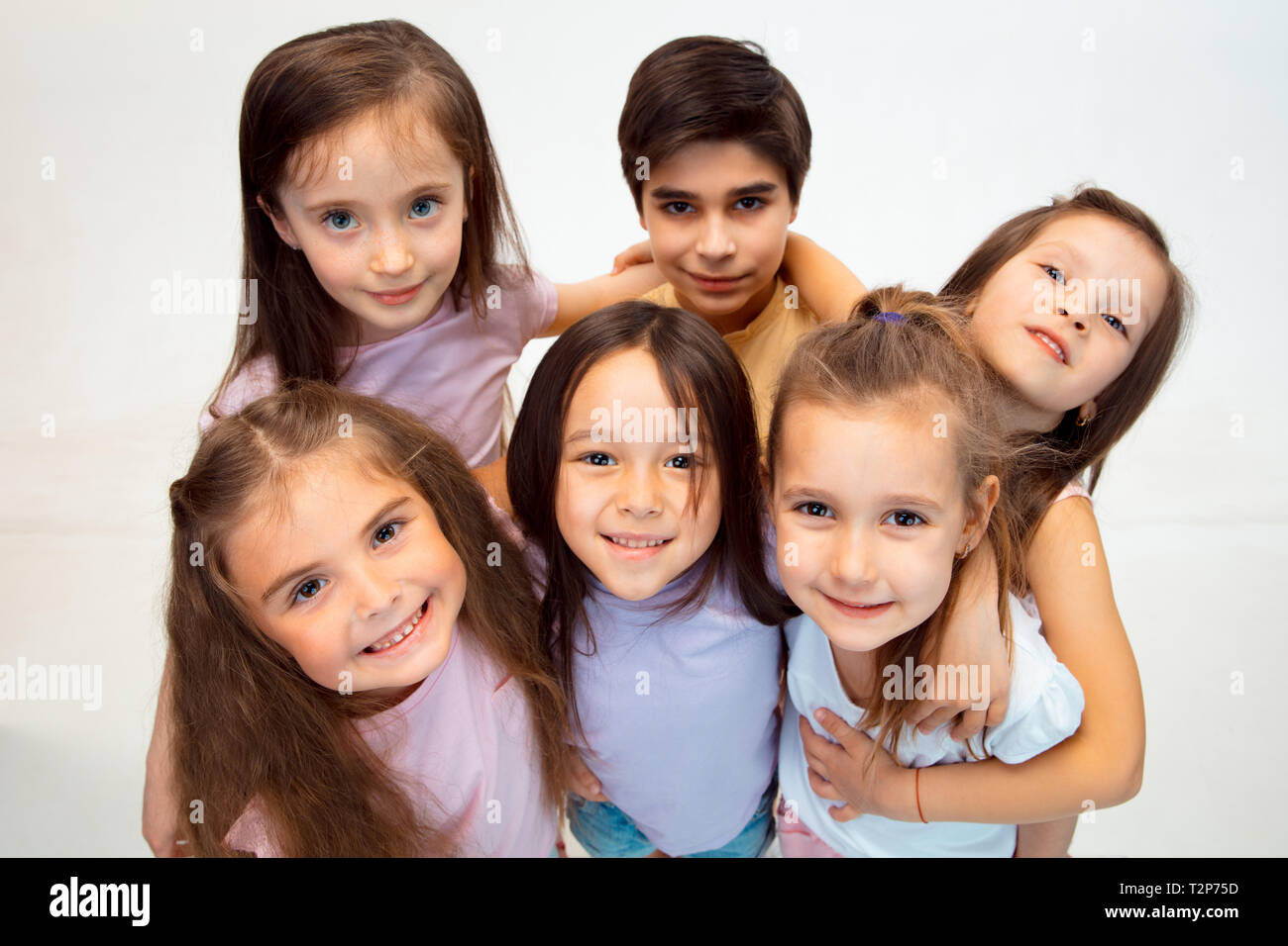 The Portrait Of Happy Cute Little Kids Boy And Girls In Stylish Casual Clothes Looking At Camera Against White Studio Wall Kids Fashion And Human Emo Stock Photo Alamy