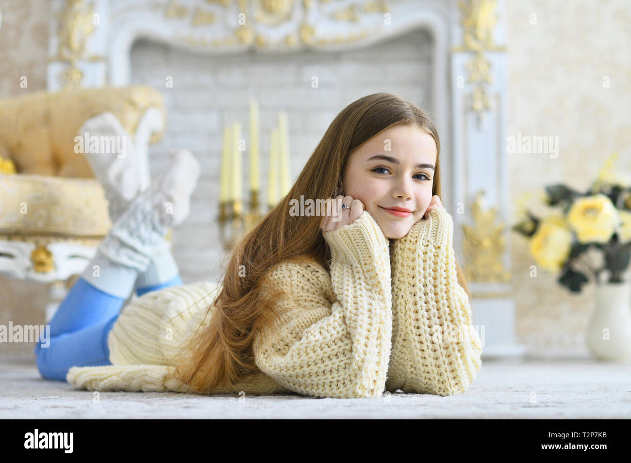 Portrait of beautiful teen girl lying on floor in room Stock Photo - Alamy