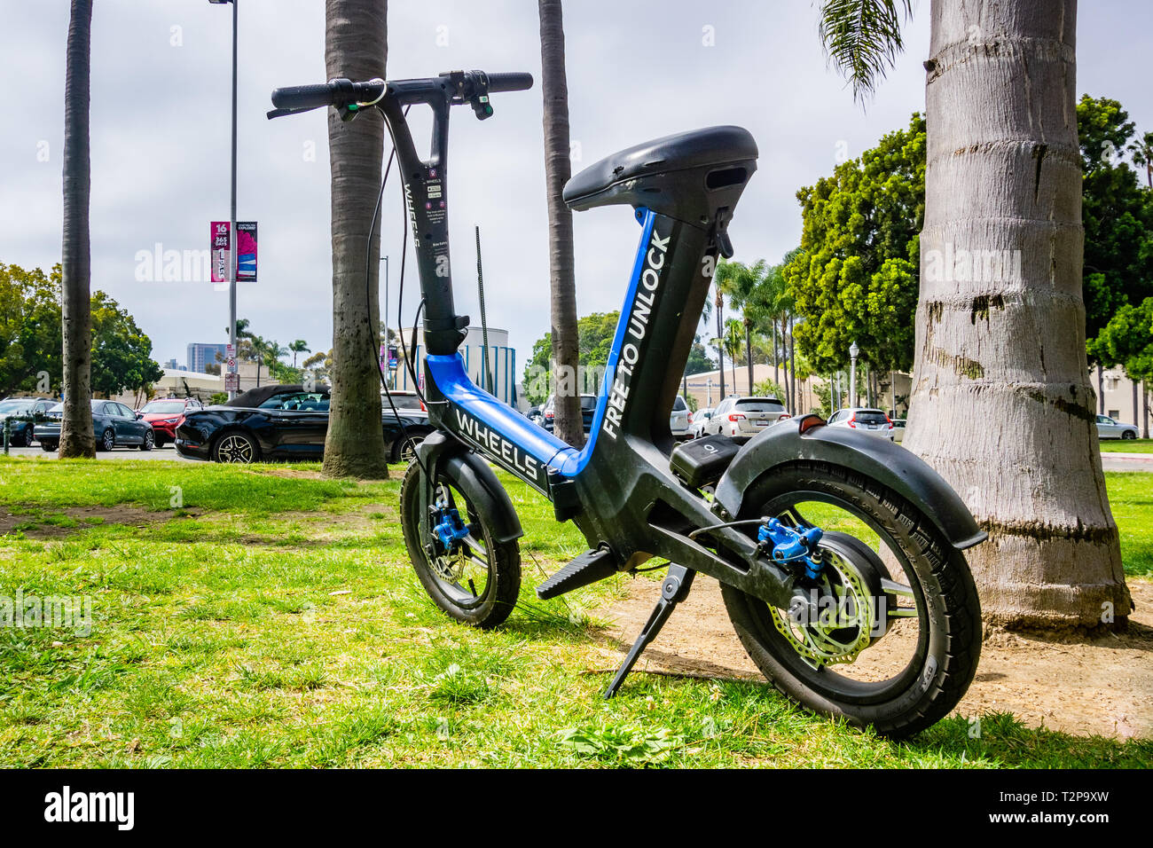 March 19, 2019 San Diego / CA / USA - Wheels custom designed mini bike parked in Balboa Park; Wheels is a new dockless e-vehicle start-up launched at  Stock Photo
