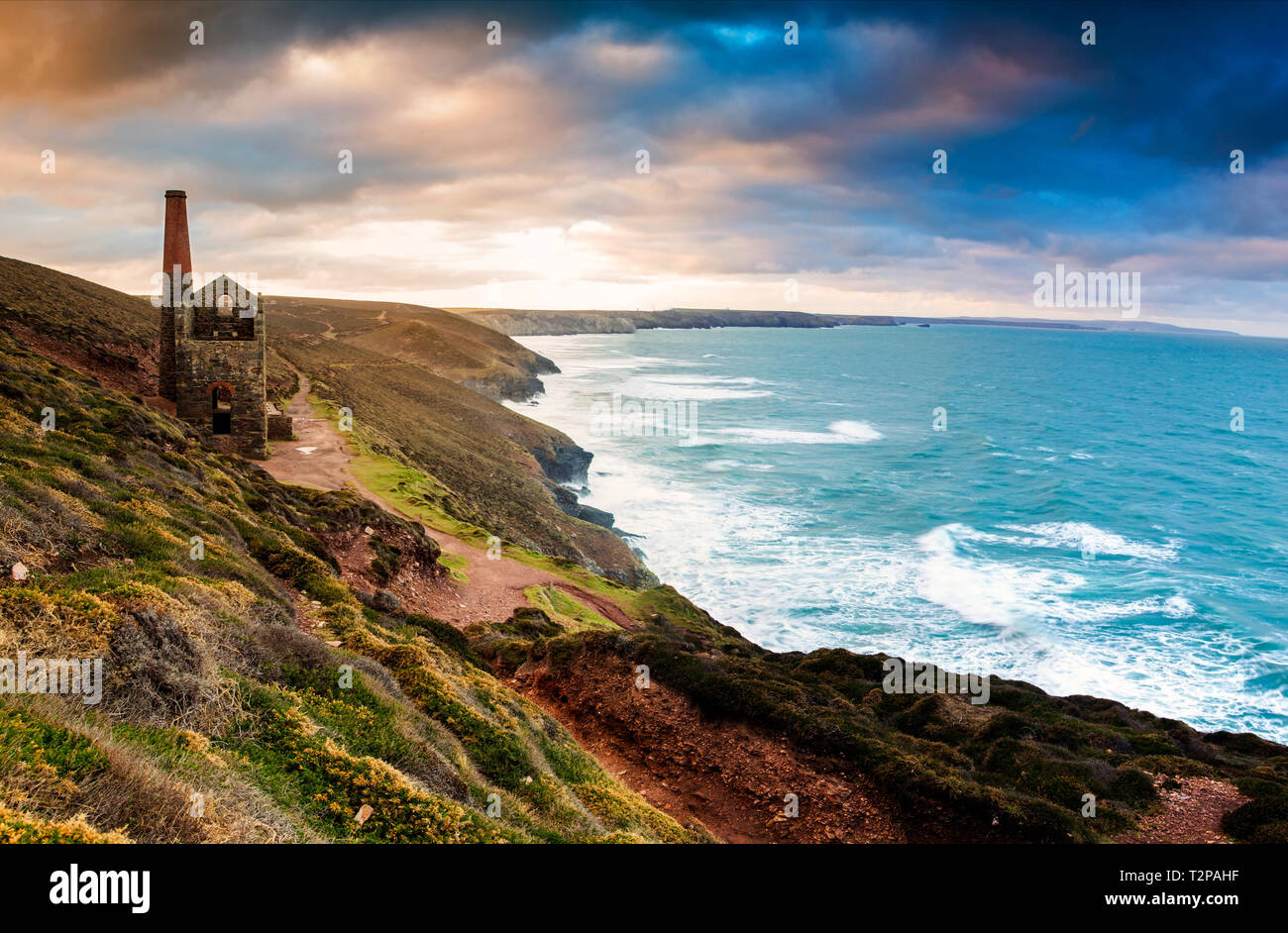 The Towanroath mine shaft at Wheal Coates, on the St Agnes coastline in Cornwall, gives this epic composition with the beautiful rugged Cornish coast Stock Photo