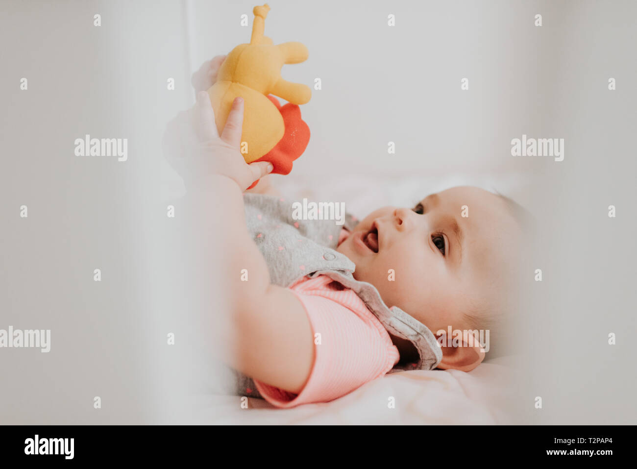 Baby in crib Stock Photo