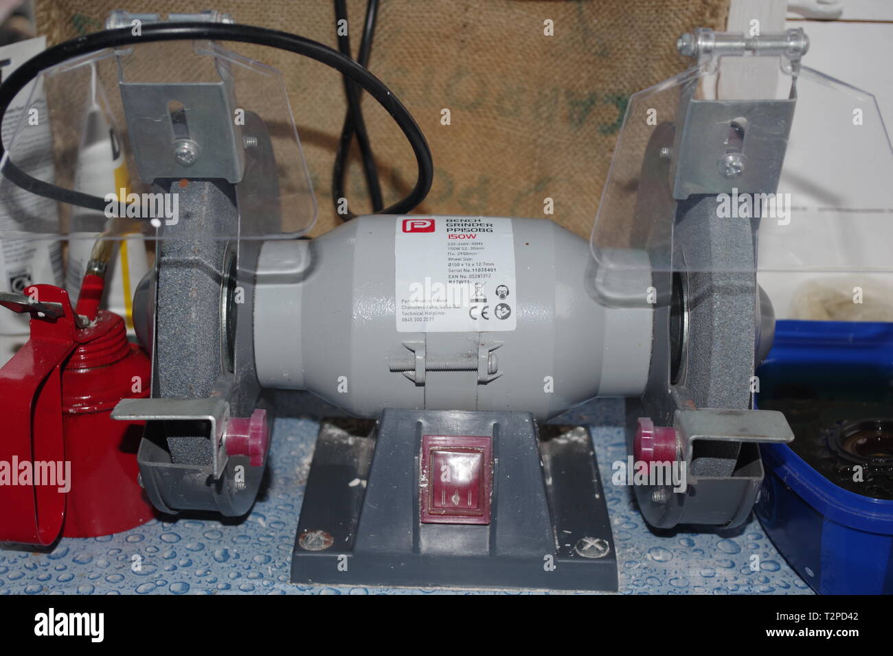 Red Oil Can on a Work Bench in a Garden Shed. Exeter, Devon, UK Stock