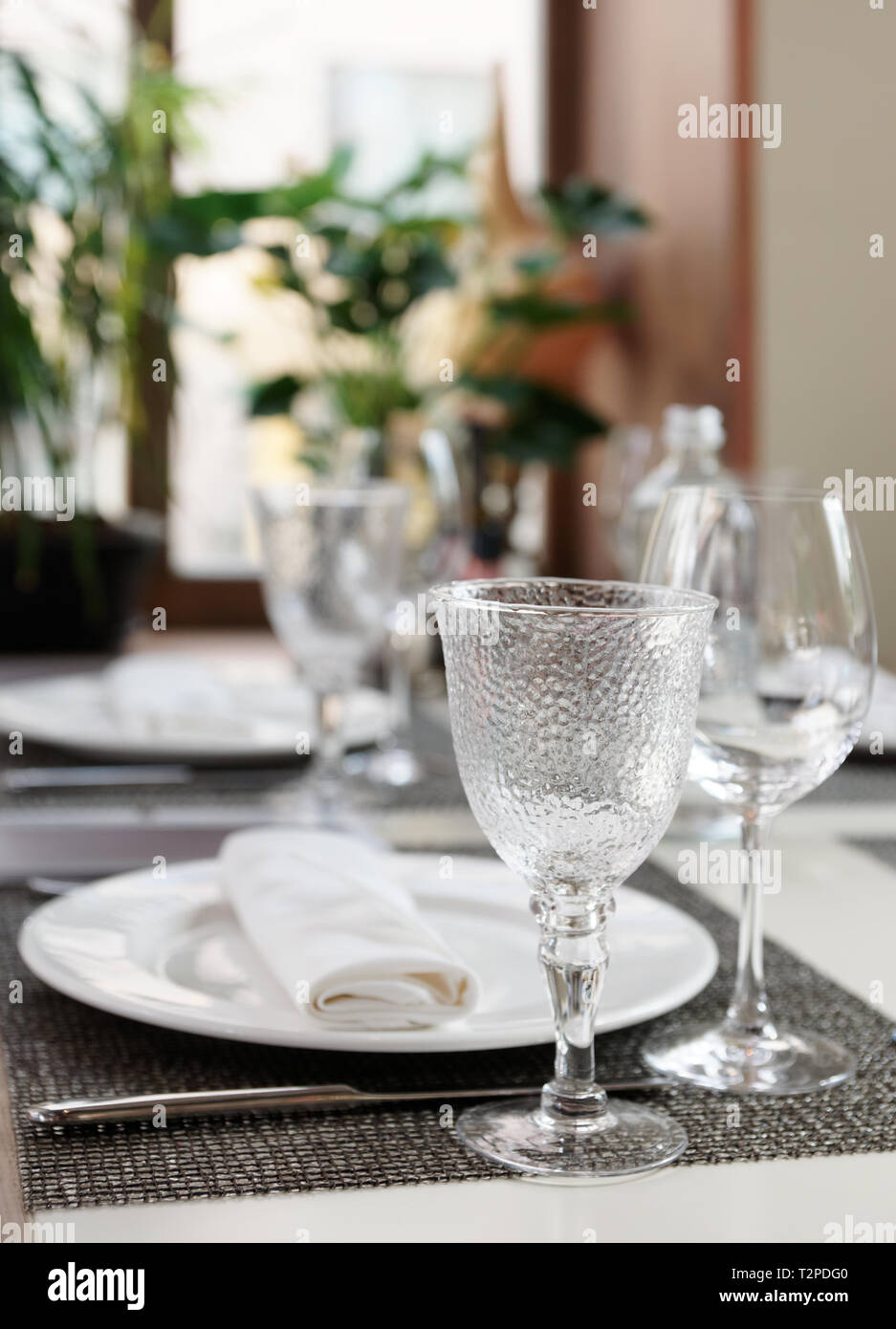 Place setting near the window in an expensive restaurant Stock Photo